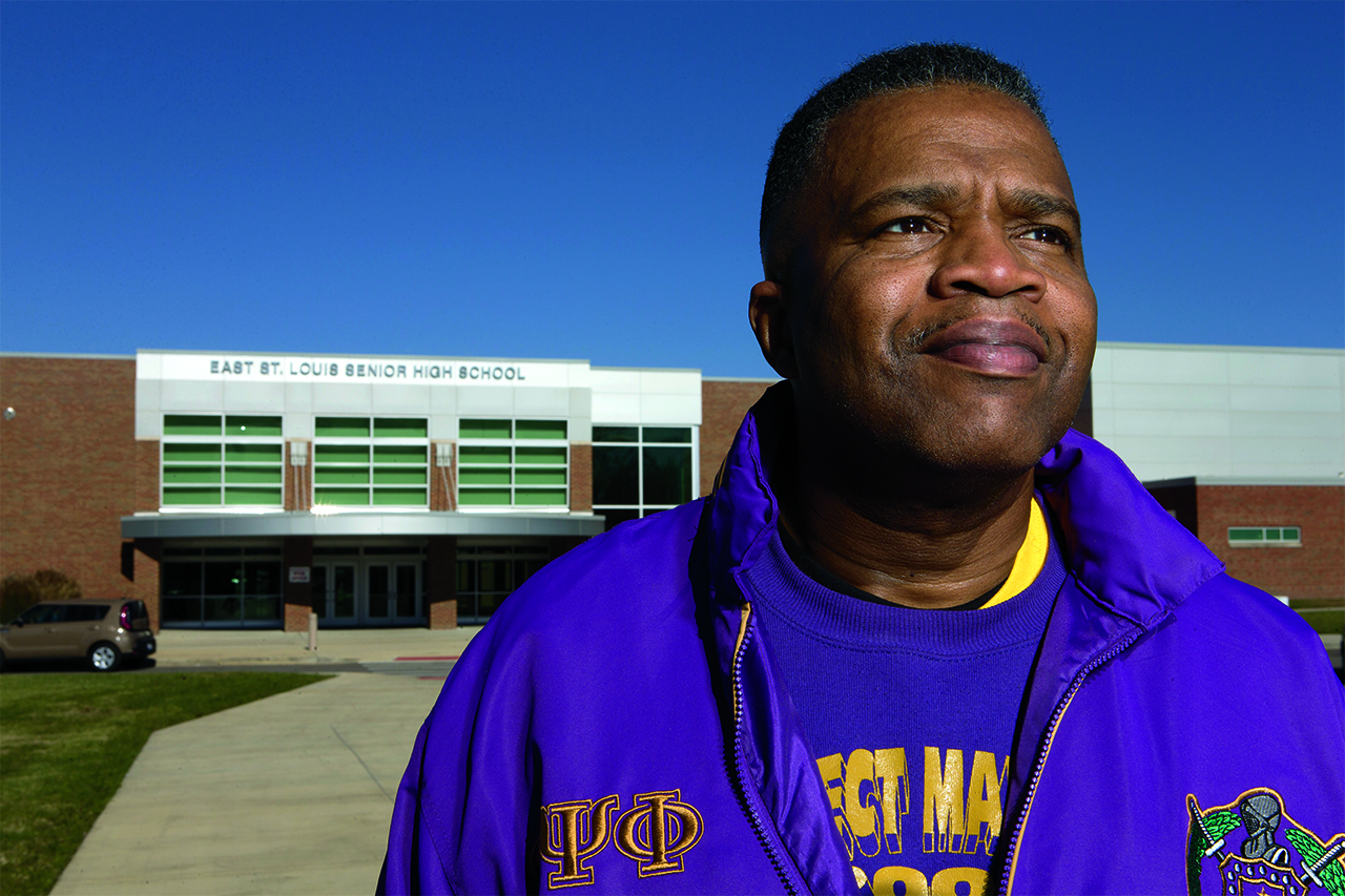 Judge Brandon in front of a school