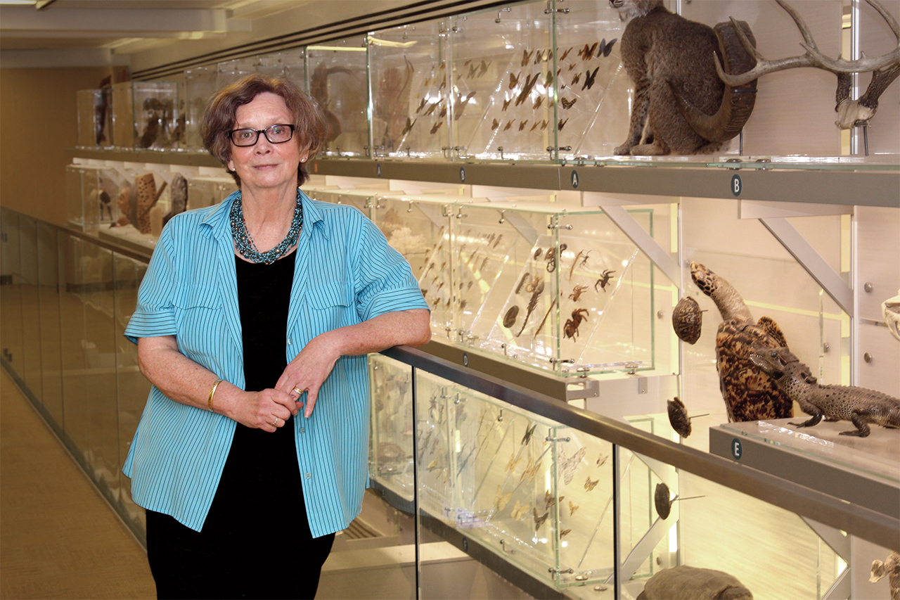 Deborah Hull-Walski stands at one of the exhibits inside Q?rius.