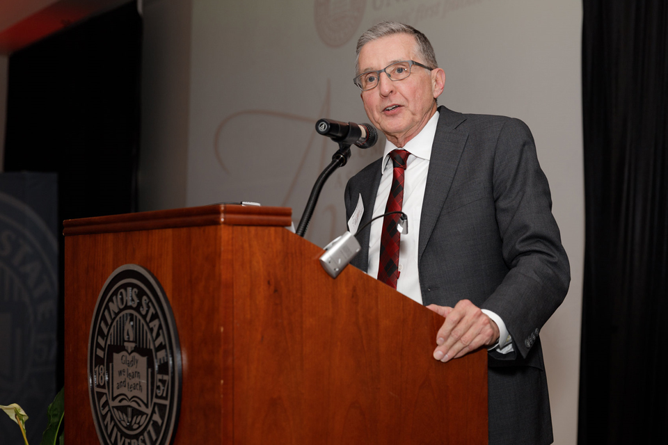 man talking at podium